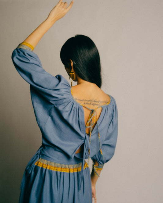 The Ara Top draws inspiration from Matisse and Yves Saint Laurent's interpretation of a Romanian peasant blouse.